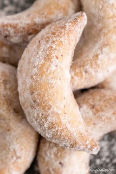 powdered sugar donuts piled on top of each other