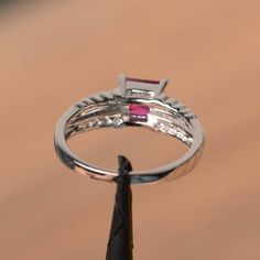 It is a lab ruby ring. The main stone is 6 mm*6 mm princess cut.weight about 1.37 carats. The basic metal is sterling silver and plated with rhodium. To change the metal to a solid gold (white/rose) or platinum is also available, please ask for a quotation if you want. You can also go to my shop Home for more elegant rings: https://www.etsy.com/shop/godjewelry?ref=hdr_shop_menu Ruby is the July birthstone. More ruby rings: https://www.etsy.com/shop/godjewelry?section_id=20709238 Customization is Ring Princess Cut, Elegant Rings, Ruby Rings, Ring Ruby, Princess Cut Rings, Red Gemstones, July Birthstone, Elegant Ring, Ruby Ring