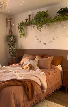 a large bed sitting next to a window in a room with plants on the wall