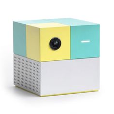 an image of a small projector that is made out of colored paper and metal