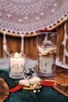 two candles sitting next to each other on a table