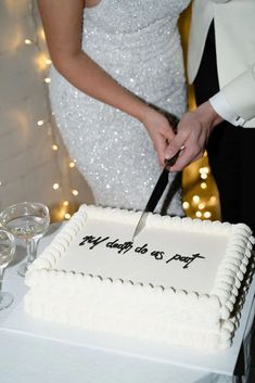 Photo of a wedding cake with a text "Till death do us  part" and a married couple cutting it Dainty Elegant Wedding Dress, Stockings Under Wedding Dress, Whimsical Micro Wedding, Type Of Wedding Themes, Whimsical Classic Wedding, Big White Wedding Cake, At Home Reception, Elope Wedding Ideas, Hasta La Muerte Wedding