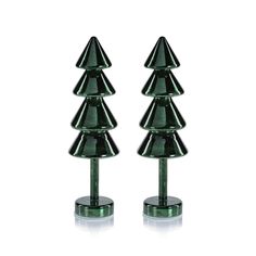 pair of green glass christmas trees on pedestals