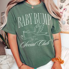 ☀️ Celebrate your summer pregnancy with "The Bump Bump Club Summer Pregnancy Announcement Shirt"! , this comfort colors beach-inspired t-shirt offers both comfort and style, perfect for those warm, sunny days. Personalize it to make your pregnancy announcement uniquely yours. Grab yours today and share your joy in the most special way! 👕 PRODUCT INFO The Comfort Colors 1717 shirt is made of 100% ring-spun cotton, pre-shrunk, and double-needle stitched for added durability. It offers a relaxed f Summer Cotton Tops Bump Friendly, Casual Maternity T-shirt Bump Friendly, Casual Maternity T-shirt, Maternity Casual T-shirt With Funny Print, Casual Maternity T-shirt With Funny Print, Casual Bump Friendly Crew Neck T-shirt, Casual Crew Neck T-shirt Bump Friendly, Summer Maternity T-shirt With Crew Neck, Maternity T-shirt With Graphic Print And Relaxed Fit