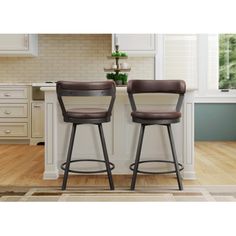 two blue stools sitting in front of a kitchen counter