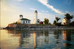 two lighthouses sitting on top of a small island