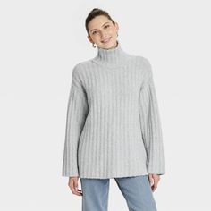 Stay cozy and look your best by wearing the Turtleneck Tunic Pullover Sweater from Universal Thread™. Tailored in a relaxed fit, this tunic sweater is made from cotton-blend ribbed fabric with added spandex for comfortable wear. Designed with ribbed cuffs for a snug fit, the pullover sweater features a turtleneck for classic style and makes an easy pairing with any of your favorite pants or skirts. Universal Thread™: Found exclusively at Target. Turtleneck Tunic, Womens Turtleneck, Womens Crewneck, Mock Turtleneck, Look Your Best, Tunic Sweater, Cozy Knits, Universal Thread, Stay Cozy