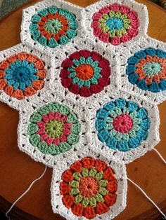 a crocheted doily is sitting on a table