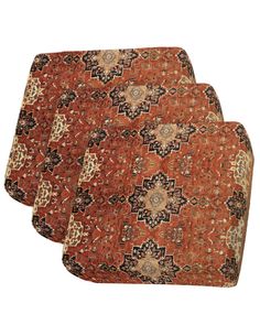 three pieces of red and brown rugs on a white background with an intricate design