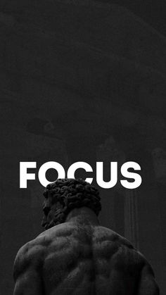 a black and white photo with the words focus in front of a man's back