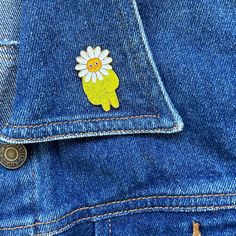 a patch on the back of a pair of jeans with a flower in its pocket