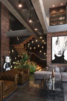 a living room filled with furniture and a staircase