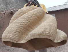 a man carrying a large sack on his back