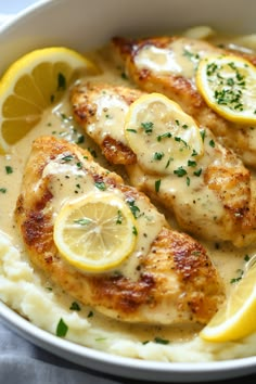 chicken with lemon sauce and mashed potatoes in a bowl