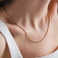 SNAKE - CHAIN - NECKLACE Introducing our exquisite Snake Chain Necklace, crafted with 18K gold and designed for women and unisex wear. This versatile piece features a waterproof design, making it perfect for everyday wear. Whether it's a Mother's Day Gift, a Valentine's Day treat, or a thoughtful Gift For Her, this gold-filled chain adds a touch of elegance to any outfit. Ideal for him or her, it's the perfect accessory to elevate any ensemble. Shop now and add this timeless gold snake chain to Minimalist Snake Chain Necklace For Gift, Minimalist Herringbone Chain Necklace Gift, Yellow Gold Adjustable Snake Chain Necklace, Yellow Gold Adjustable Snake Chain Necklace As Gift, Adjustable Yellow Gold Snake Chain Necklace For Gift, Minimalist Delicate Snake Chain Necklace As Gift, Minimalist Snake Chain Necklace As Gift, Minimalist Delicate Snake Chain Necklace For Gift, Gold Snake Chain Necklace Gift