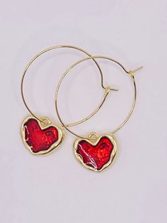 Red heart hoop earrings, gold and red heart earrings, heart hoop earrings, gold and red heart hoop earrings, valentine earrings, valentines gift These heart earrings measure 1.25 inches in diameter and the heart charm is 1/2 inches These earrings are very pretty and would make a perfect gift for that special person on Valentine's Day.