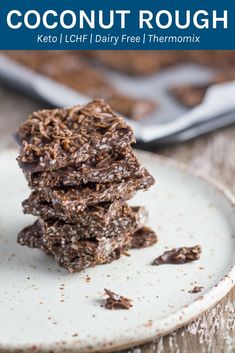 three chocolate treats stacked on top of each other in front of a pan of cookies