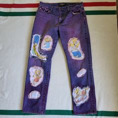 an old pair of jeans with patches on them