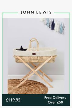 a baby's bassinet with the text free delivery over $ 50 from john lewis