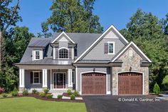 a large house with two garages on the front and one story home in the back