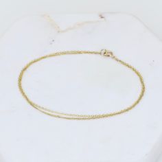 "14K Gold Dainty Double Chain Bracelet - 14K Solid Gold Bracelet ★ The chains and all components are 14K solid yellow gold The length includes the chain and the closure. Please measure your wrist before you place your order. ** How to choose a correct size of bracelet. 1. Measure your wrist below the wrist bone using a flexible tape measures, a string or a strip of paper. 2. If using a string or a strip of paper, mark length. Then, measure it with a ruler. 3. To find the bracelet size, add 1/2\" Delicate Chain Yellow Gold-plated Bracelet, Yellow Gold Recycled Gold Bracelet As A Gift, Yellow Gold Recycled Gold Bracelet For Gift, Yellow Gold-plated Bracelet With Delicate Chain, Gift Yellow Gold Bracelet In Recycled Gold, Delicate 14k Yellow Gold Chain Bracelet, Delicate Yellow Gold-plated Chain Bracelet, Fine Jewelry Adjustable Yellow Gold Bracelet, Delicate Chain Bracelet In Yellow Gold