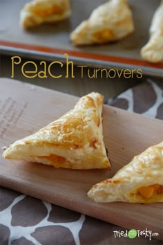 two pieces of food on a cutting board with the words peach turnoverers in front of them