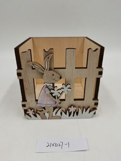 a wooden box with an image of a rabbit on it