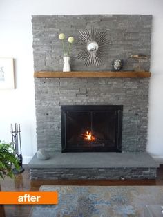 a living room with a fire place in the middle of it and a rug on the floor