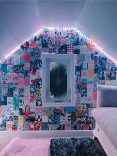 a room with a bed, mirror and lights on the wall above it is decorated in many different colors