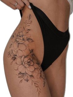 a woman's stomach with flowers on it and the bottom half of her body