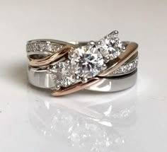 three stone diamond ring set in white and rose gold