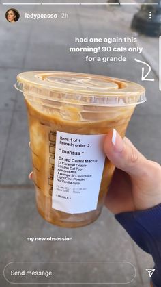 someone is holding up a plastic cup with food in it and an ad on the side