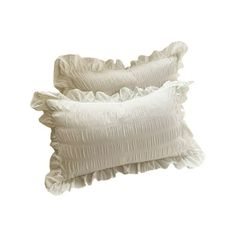 two white pillows with ruffled edges