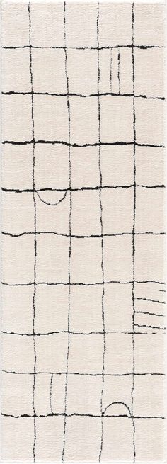 a white rug with black lines on the side and one line drawn across it in different directions