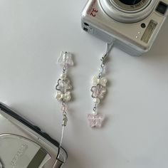 a camera and some beads on a table