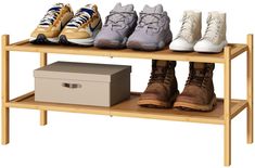 four pairs of shoes are lined up on a shelf next to a box and shoebox