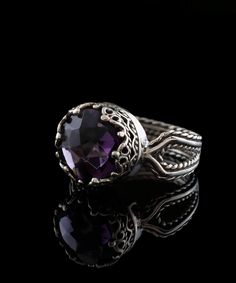 Looking for the perfect gift for your girlfriend, wife, mother, or sister? This gorgeous silver filigree art women's cocktail ring is the ideal choice. With its intricate details and beautiful face-up design, this ring is sure to stand out and make an impression. It features a double-sided, faceted checkerboard round-cut amethyst gemstone that measures 10mm and has a face size of 0.47 inches (12.00mm) in width. Not only is this ring stunning, but it also comes with a velvet pouch, silver polish Luxury Amethyst Ring With Intricate Design, Elegant Amethyst Crystal Ring With Accent Stones, Elegant Amethyst Crystal Ring With Center Stone, Elegant Amethyst Birthstone Crystal Ring, Elegant Amethyst Crystal Ring Round Cut, Sterling Silver Purple Jewelry With Intricate Design, Purple Sterling Silver Jewelry With Intricate Design, Sterling Silver Jewelry With Intricate Design In Purple, Elegant Purple Crystal Sterling Silver Ring