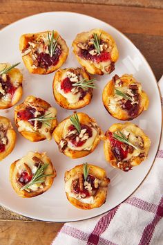 small appetizers are arranged on a white plate