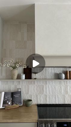 a stove top oven sitting inside of a kitchen next to a wall mounted range hood