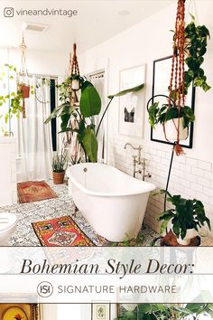 a white bath tub sitting in a bathroom next to a toilet and plant on the floor