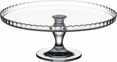 an empty glass cake plate on a white background