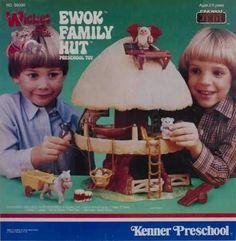 two children are playing with a doll house in front of the magazine's cover