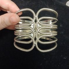 It Is A Silver Bangle. Elegant Metal Bracelets For Summer, Elegant Metal Bracelet For Summer, Trendy Spring Party Bangle, Elegant Metal Bangle For Spring, Chic Silver Bangle For Party, Chic Metal Cuff Bracelet For Spring, Bohemian Metal Bracelets For Spring, Spring Bohemian Metal Bracelets, Vintage Adjustable Cuff Bracelet For Spring