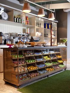 an open kitchen with lots of food on display