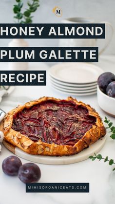 a pie on a plate with the words honey almond plum galette recipe in front of it