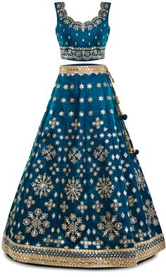 This 3-piece teal blue lehenga set is dripping in light champagne gold embroidery making it shine brighter than a disco ball! The lehenga itself is shiny because of the mirror work, so you might catch glimpses of your reflection in passing. Plus, the blouse features a clever tie-string back, ensuring you're always comfortable and adjustable for any spontaneous dance-off. Step into 'Naiki' and let your inner Indian queen shine! Blue Gota Work Dress For Festive Occasion, Blue Sequined Sets For Festive Occasions, Traditional Blue Sequin Choli, Blue Sequined Sets For Festivals, Blue Sequined Choli For Diwali, Blue Anarkali Set With Sequins For Reception, Blue Sequined Lehenga For Festive Occasions, Blue Party Sharara With Gota Work, Blue Sharara With Gota Work For Party