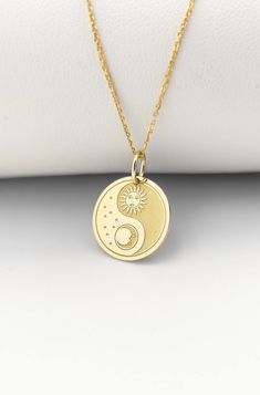 Welcome to ElegantGoldJewels,  Find all the information you need about your charm: Material of pendant: 14K Solid Gold Stamp: 585 (14K) Thickness: 0.5mm Jumpring Diameter: 4mm The pendant is available in 6 sizes: - 13mm / 0.52 inches - 15mm / 0.59 inches - 18mm / 0.70 inches - 20mm / 0.78 inches - 22mm / 0.86 inches - 24mm / 0.94 inches - 26mm / 1.02 inches - 28mm / 1.10 inches - 30mm / 1.18 inches Chains Information: Rolo Chain: -14K Real Gold - 0.70mm thick - Spring Ring Clasp - 16 inches / 40 Sun And Moon Design Charm Necklaces, Symbolic Round Necklace With Sun And Moon Design, Celestial Sun And Moon Charm Necklaces, Spiritual Round Moon Charm Necklace, Celestial Sun And Moon Charm Necklace, Spiritual Round Moon Phase Charm Necklace, Necklace Sun And Moon, Yin Yang Jewelry, Sun Moon Necklace