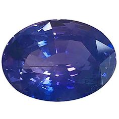 an oval blue sapphire stone on a white background