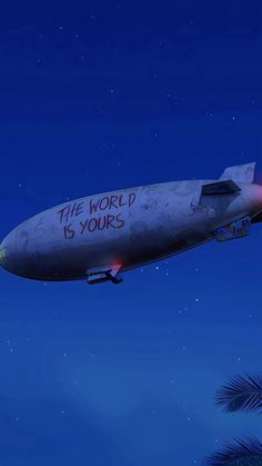 an airplane with the words the world is yours written on it flying in the sky