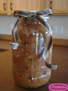 a jar filled with food sitting on top of a counter